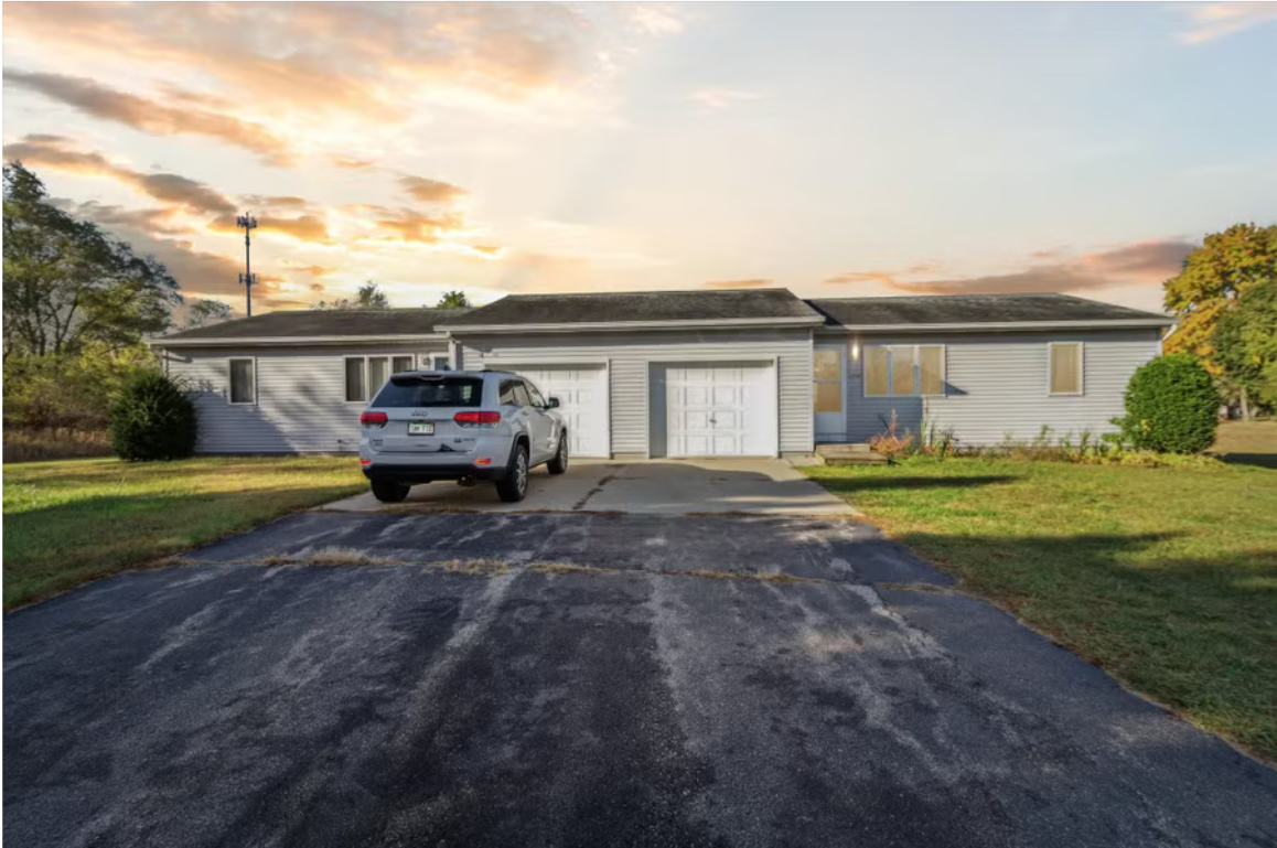 Michigan rental home with driveway at sunset